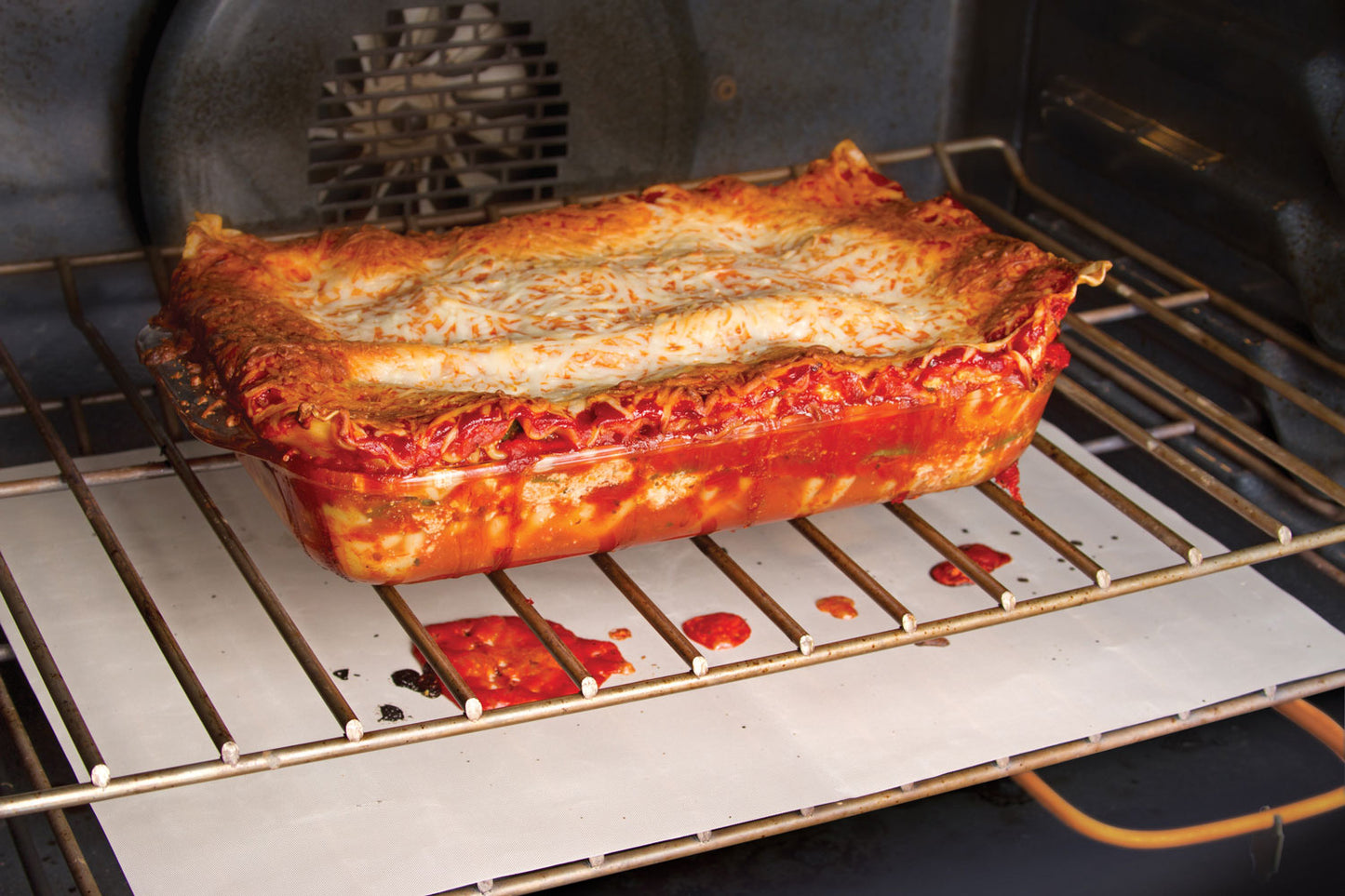 Non Stick Oven Spill Guard Stops Food Drippings Fall on Oven Floor, Forget Scrubbing Cleaning Messy Ovens, Re-sizable